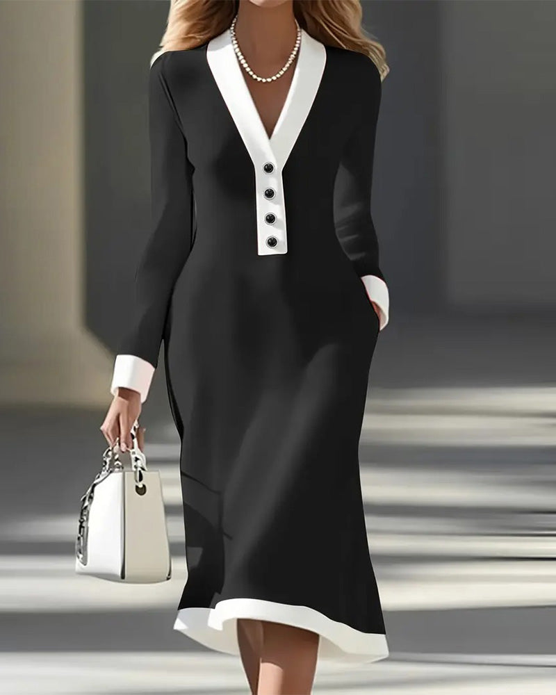 Women's long-sleeve V-neck dress in black with white contrast detail and decorative buttons