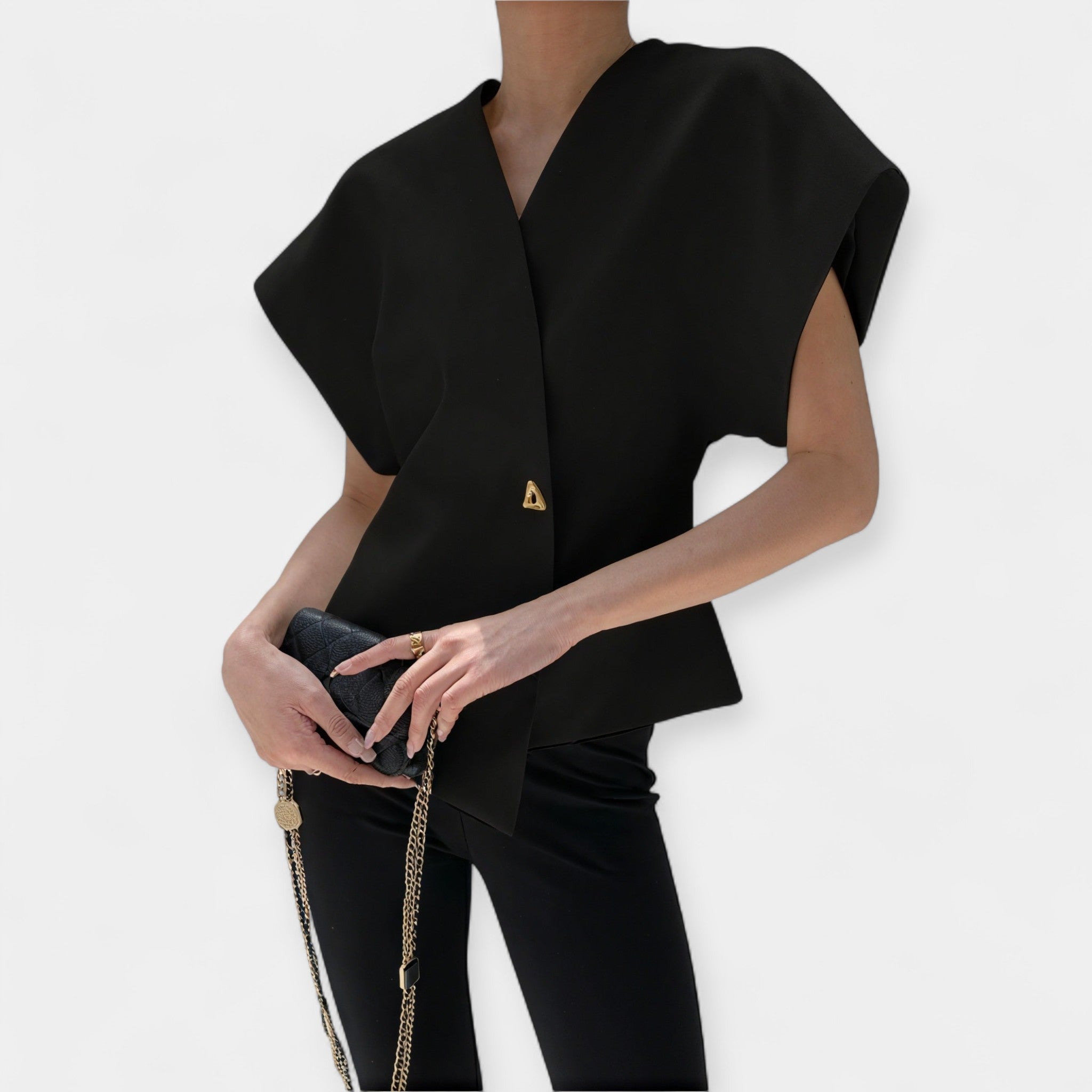 White structured minimalist top with clean lines and a quietly elegant silhouette