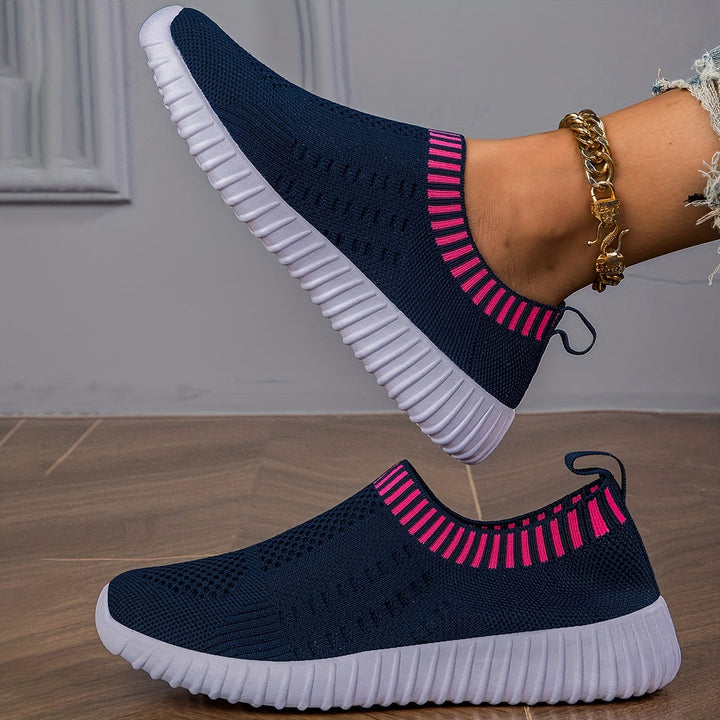 A woman slipping on ultralight sock-style trainers that hug the foot.