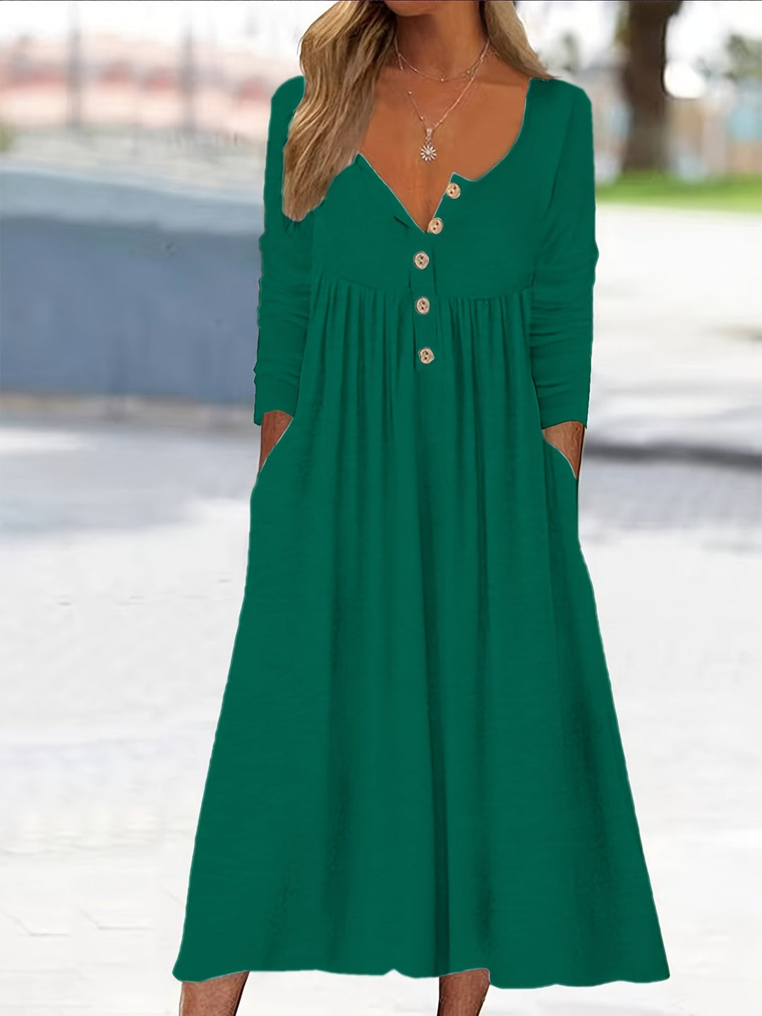 A woman wearing the Bernadette button-front midi dress with an A-line skirt, dressed for a casual day out.