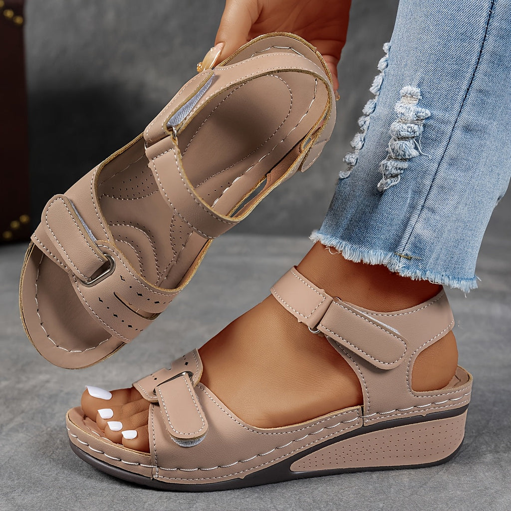 Wedge sandals with three adjustable velcro straps in a warm camel tone