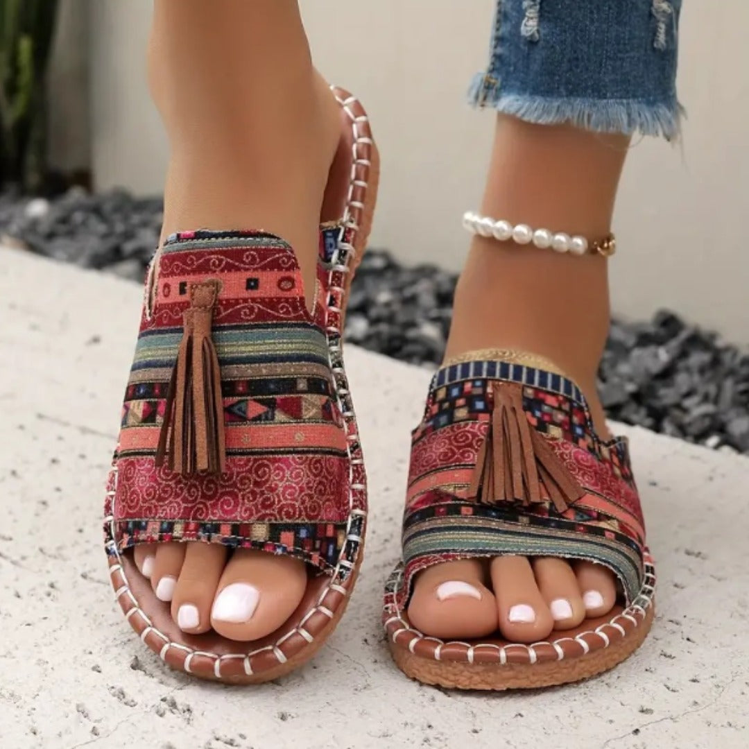 Colourful ethnic-print sandals with tassel detail and open design