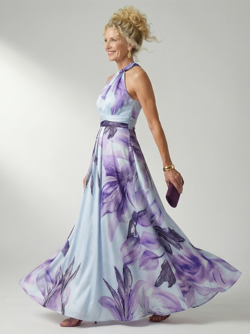 White floral halter-neck maxi dress with large bold print and flowing relaxed skirt
