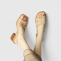 Apricot slingback heels with a single clean strap and wide block heel