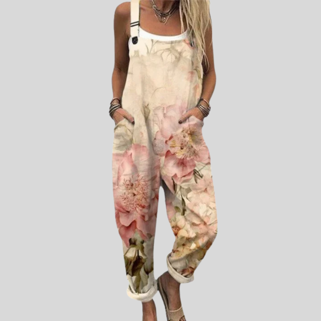 Wide-leg cream dungarees with large blush and peach watercolour roses, adjustable straps, from Mary Cork Ireland.