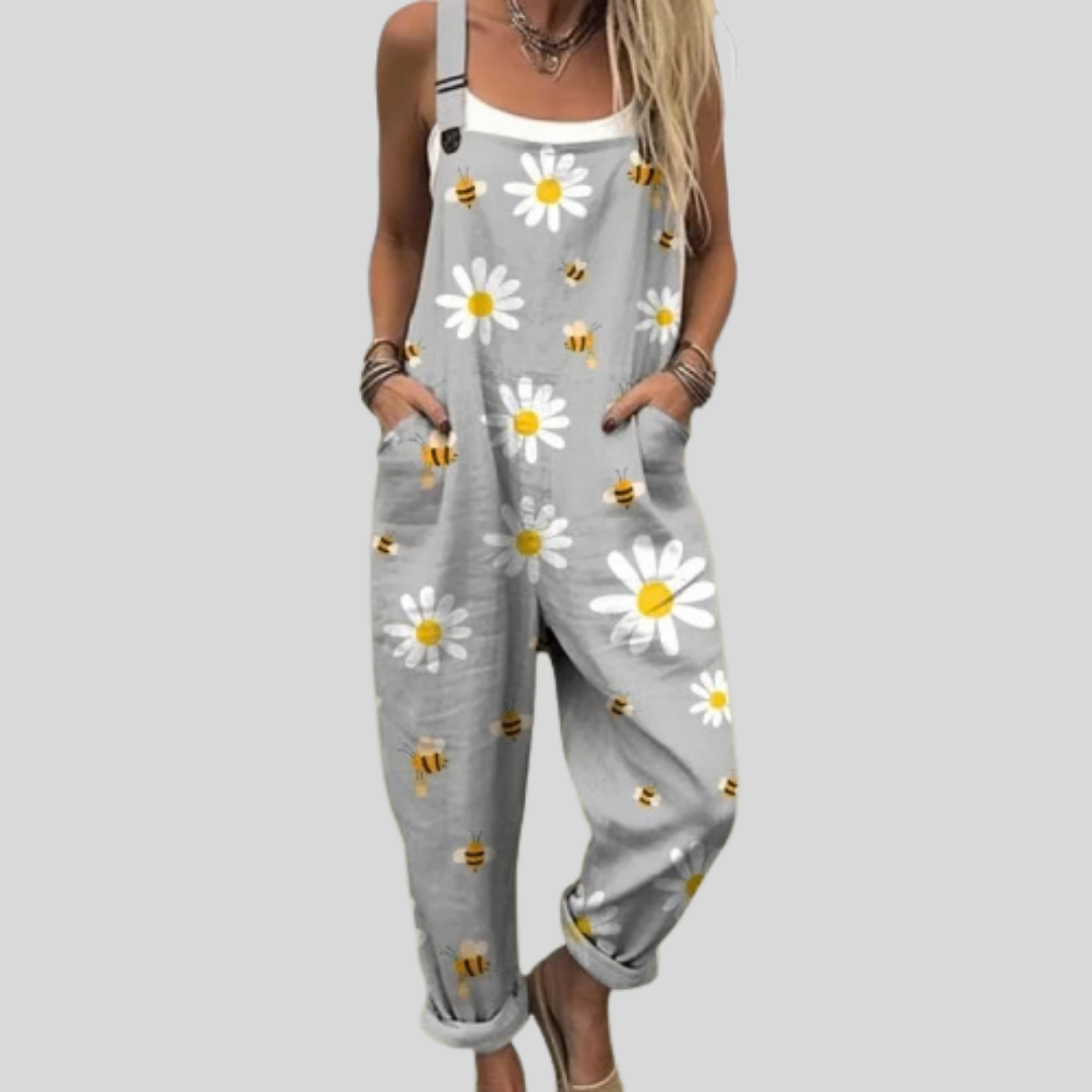 Soft grey wide-leg dungarees with a cheerful print of white daisies and little bees.