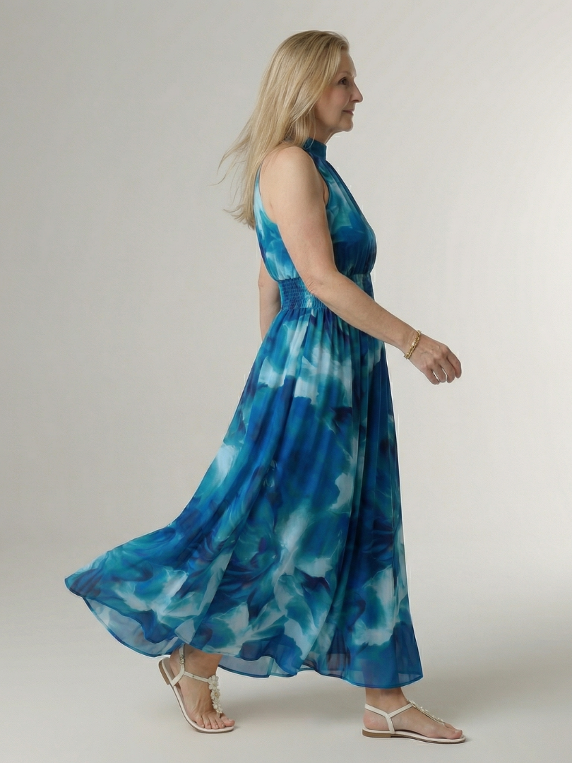Yellow halter neck midi dress with a ruched waist detail in a clean, simple silhouette