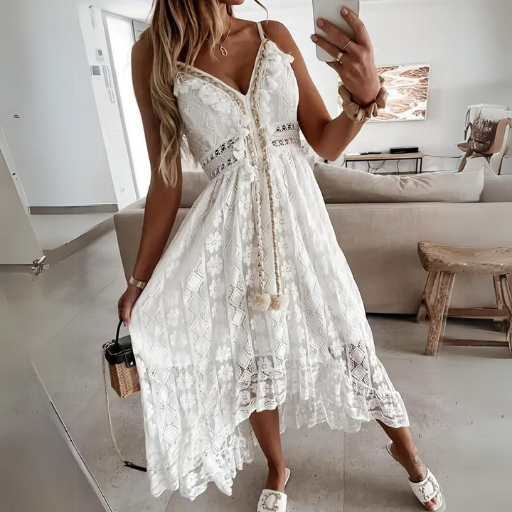 Woman wearing the Alice™ elegant boho midi dress with intricate detailing and a V-neckline at a summer garden party.