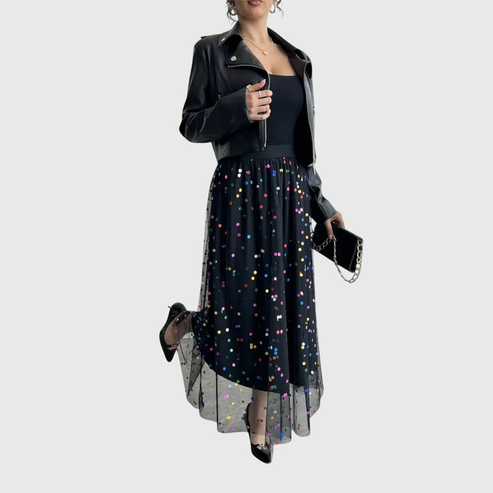 A woman in a light pleated skirt with a flowing fall, styled for an effortless everyday look.