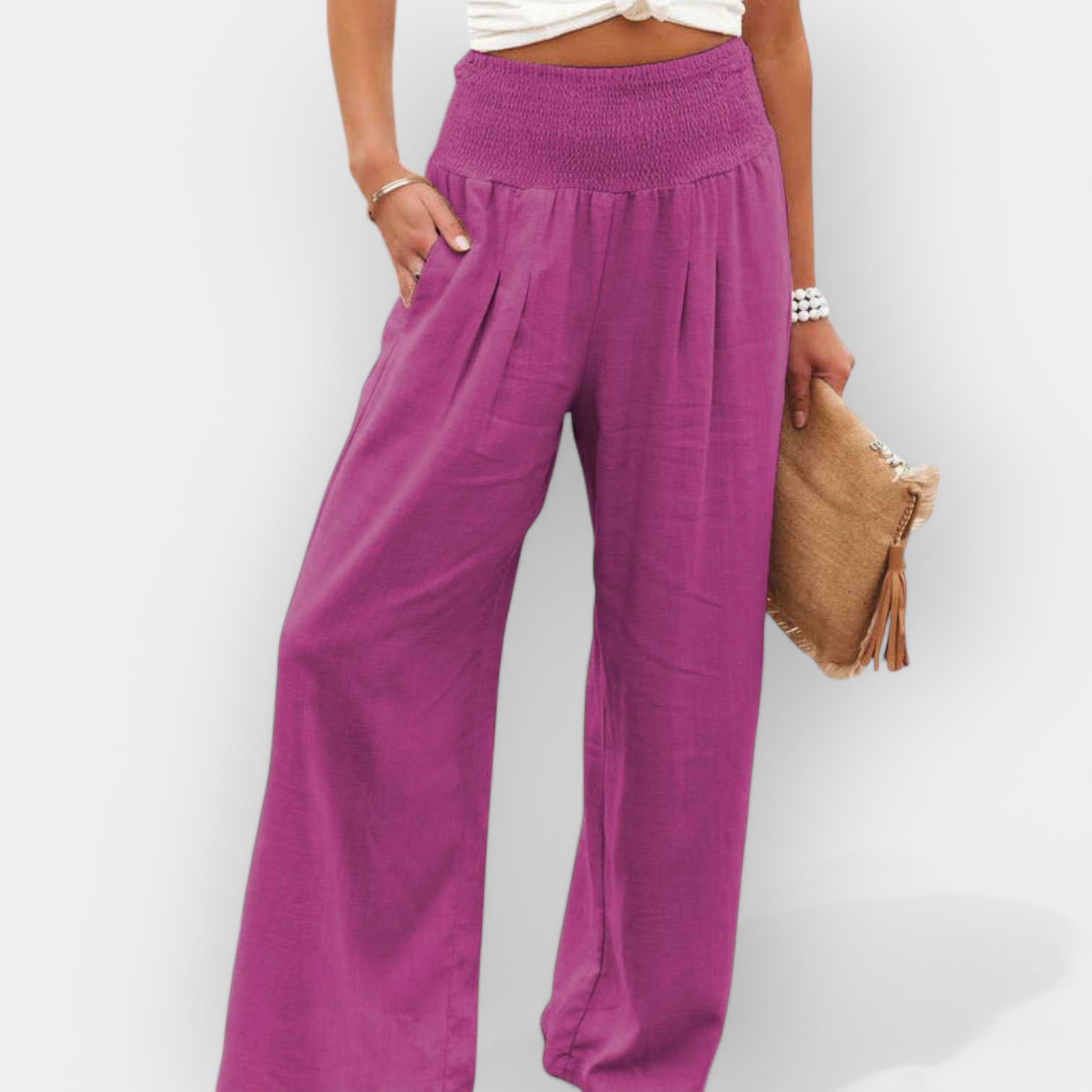 White wide-leg trousers with an elastic waist and a light, flowing silhouette