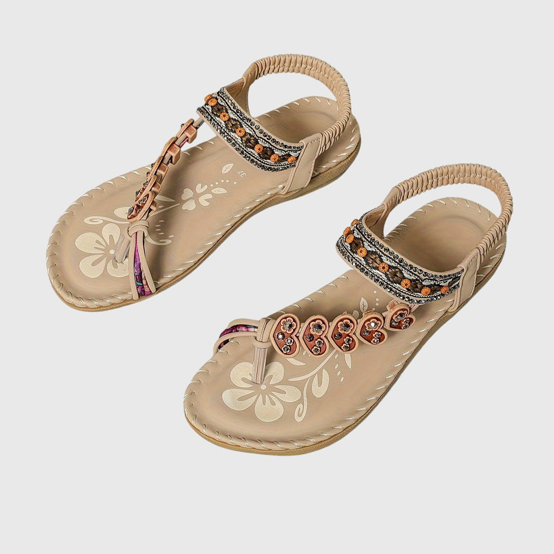 A woman standing comfortably in wide-fit cushioned support sandals with open-toe straps.