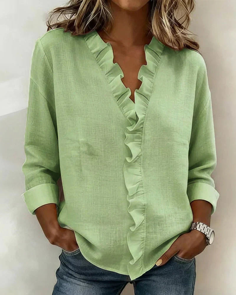Pink women's V-neck blouse with decorative frill collar and long sleeves