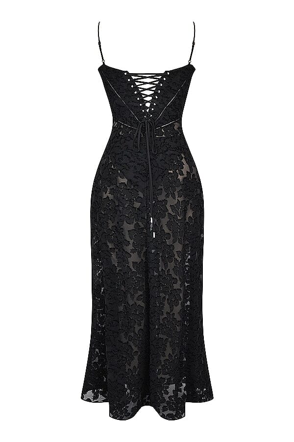 An elegant floor-length occasion dress in blush pink, styled for a formal wedding or gala event