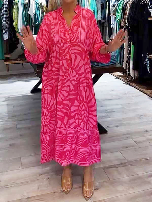 Woman wearing the Oonagh™ vivid printed maxi dress with a button front, standing confidently outdoors.
