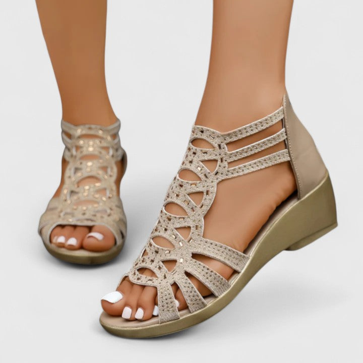 A woman wearing black elegant sandals with a cushioned sole and adjustable strap.