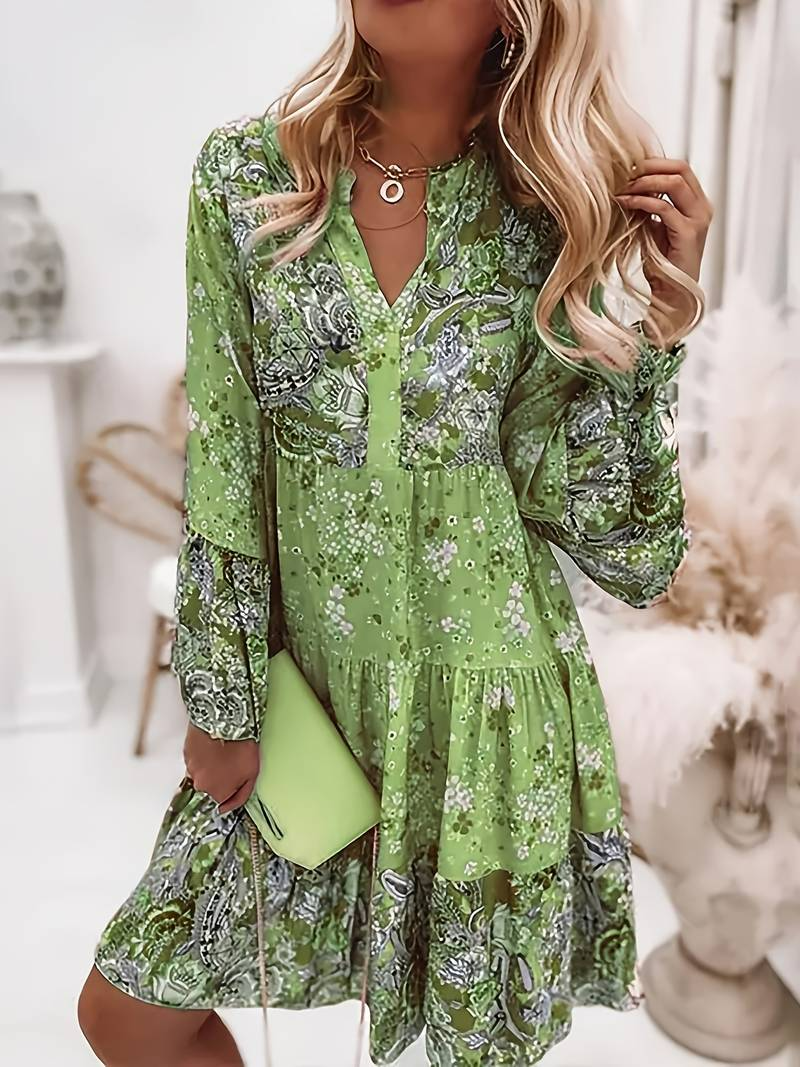 Woman in a relaxed boho dress with a colourful paisley and floral print.