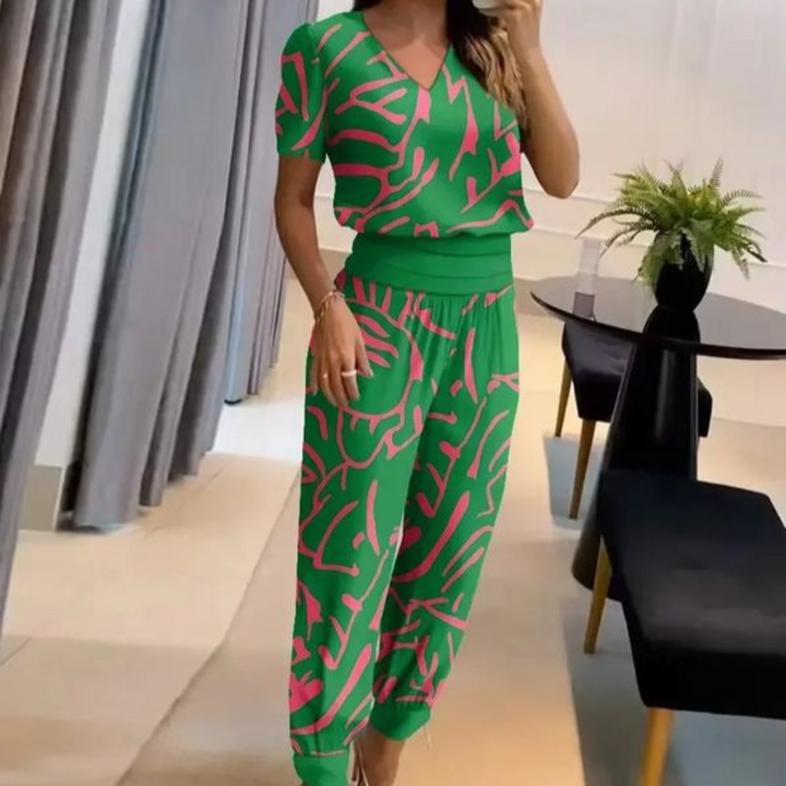 A woman wearing a plain V-neck top with geometric print slim trousers, chic and comfortable.