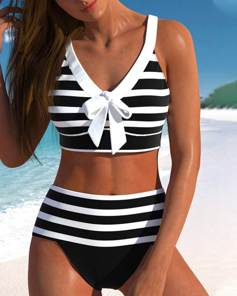 Black and white striped high-waist bikini with a knotted front detail on the top
