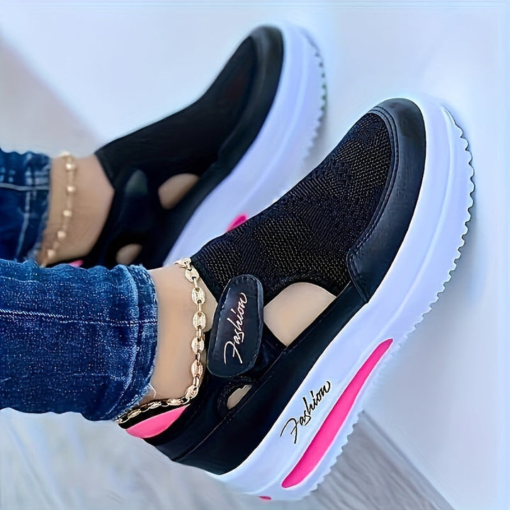 A woman slipping on breathable, cushioned slip-on trainers with trousers