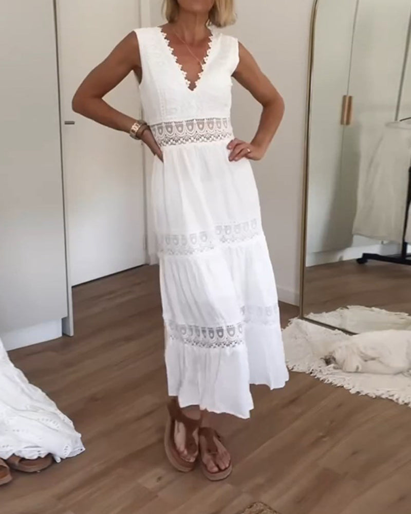 Woman wearing the Marian™ camisole maxi dress with delicate detailing and a flowing skirt at a summer gathering.