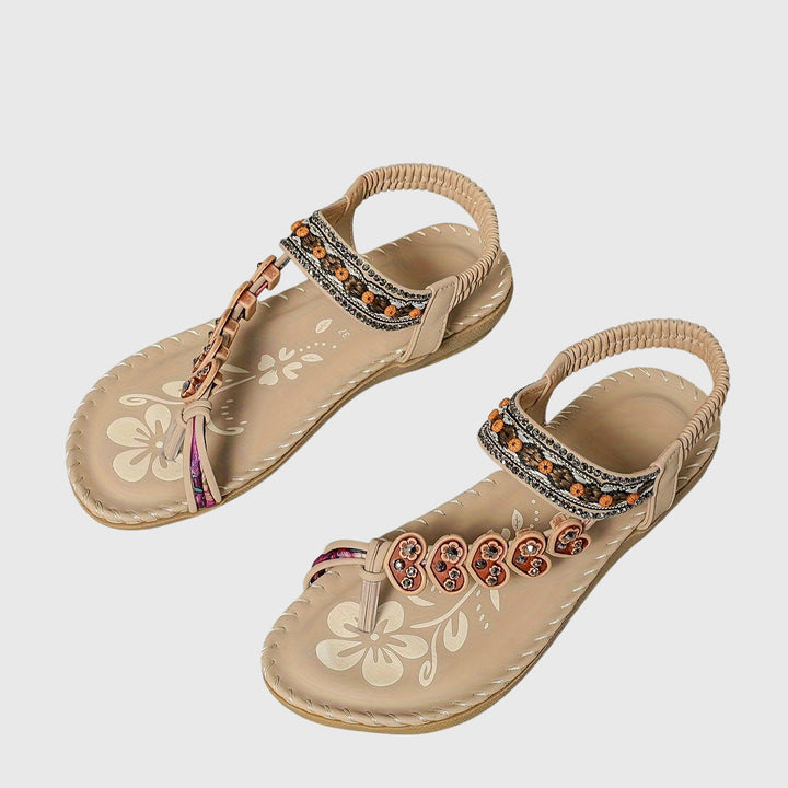 A woman standing comfortably in wide-fit cushioned support sandals with open-toe straps.