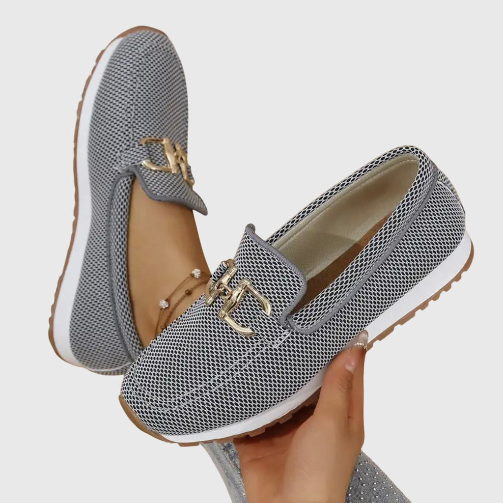 Women's beige comfort slip-on trainers with a cushioned sole and elegant metallic detail