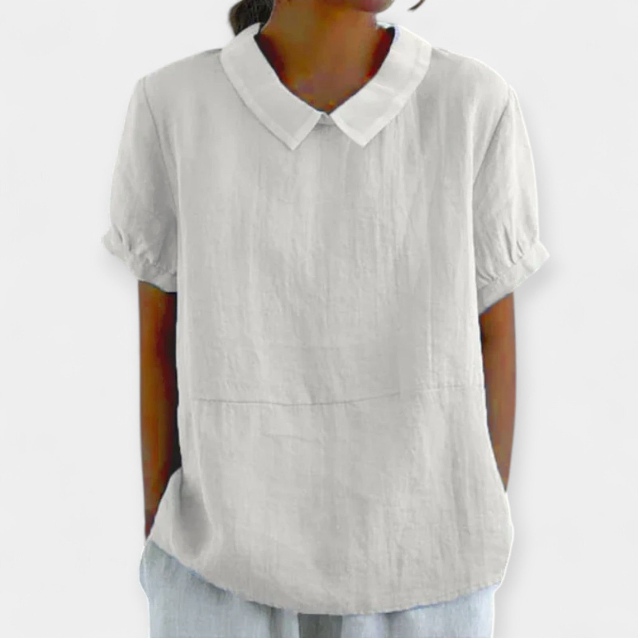 Pale blue collarless everyday blouse with a refined neckline and relaxed comfortable fit
