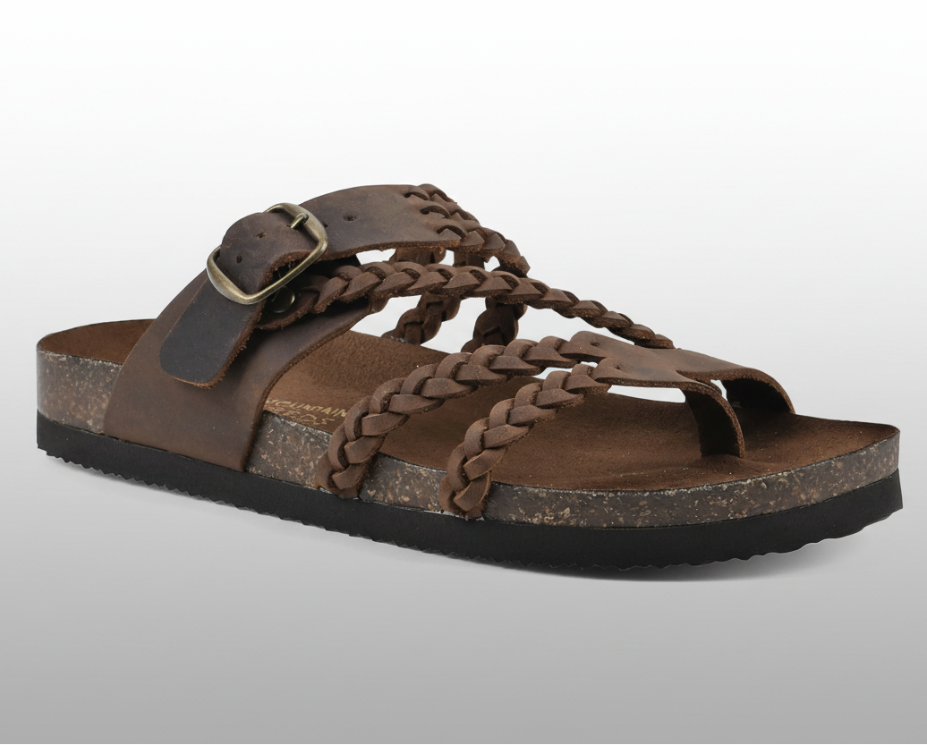 Natural woven flat sandal with an adjustable buckle strap and cushioned footbed