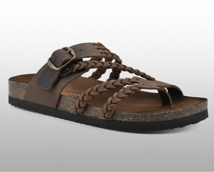 Natural woven flat sandal with an adjustable buckle strap and cushioned footbed