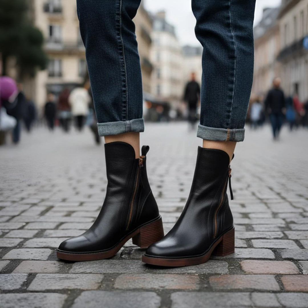 Classic black ankle boots with a stable heel and side zip fastening