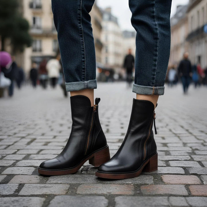 Classic black ankle boots with a stable heel and side zip fastening