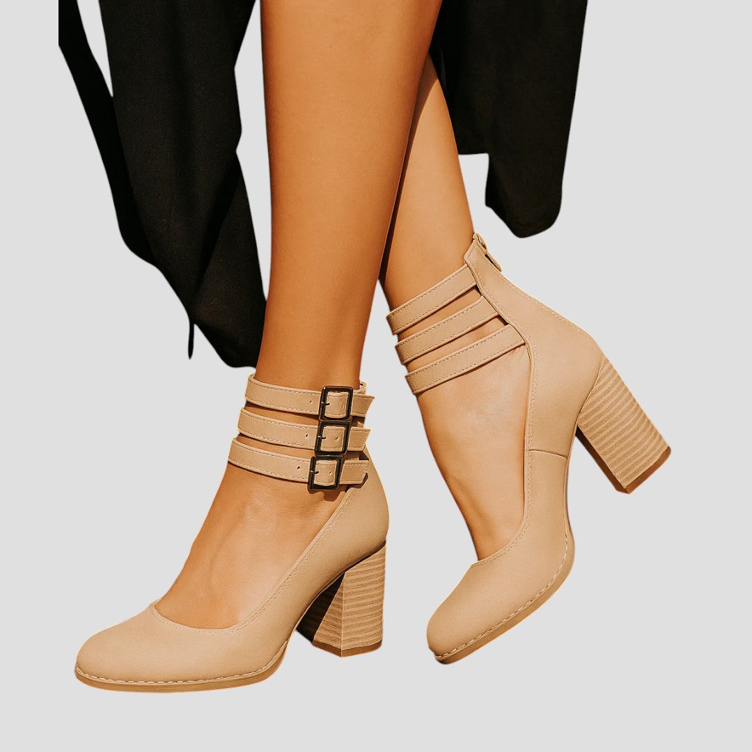 A woman walking on an autumn day wearing elegant wide-fit orthopaedic boots.