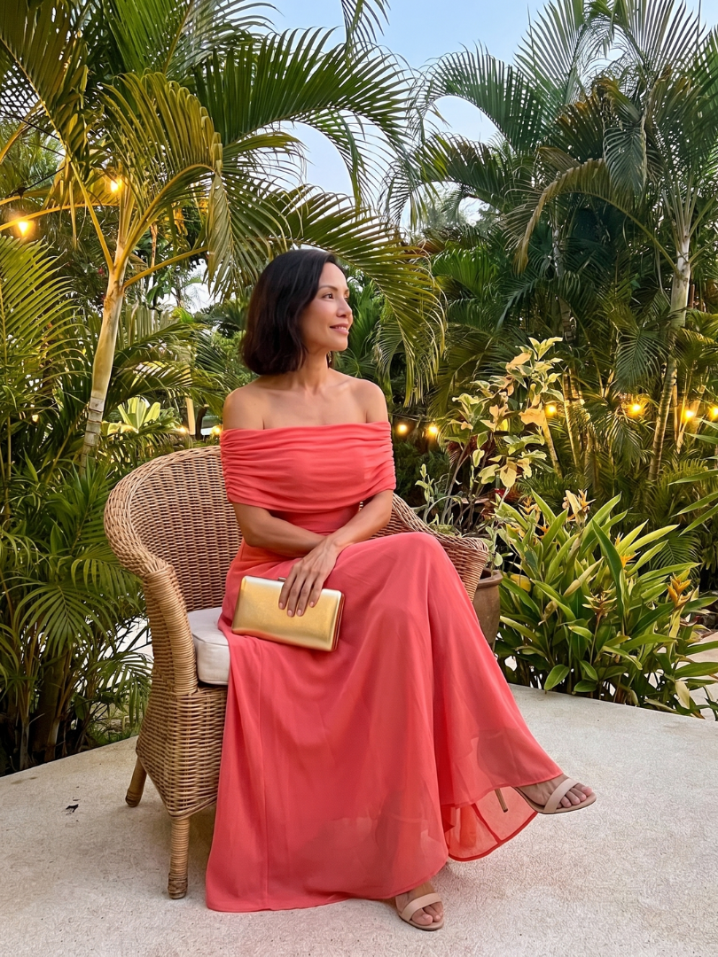 Brown midi dress with off-shoulder draped neckline and sheer outer layer over smooth lining
