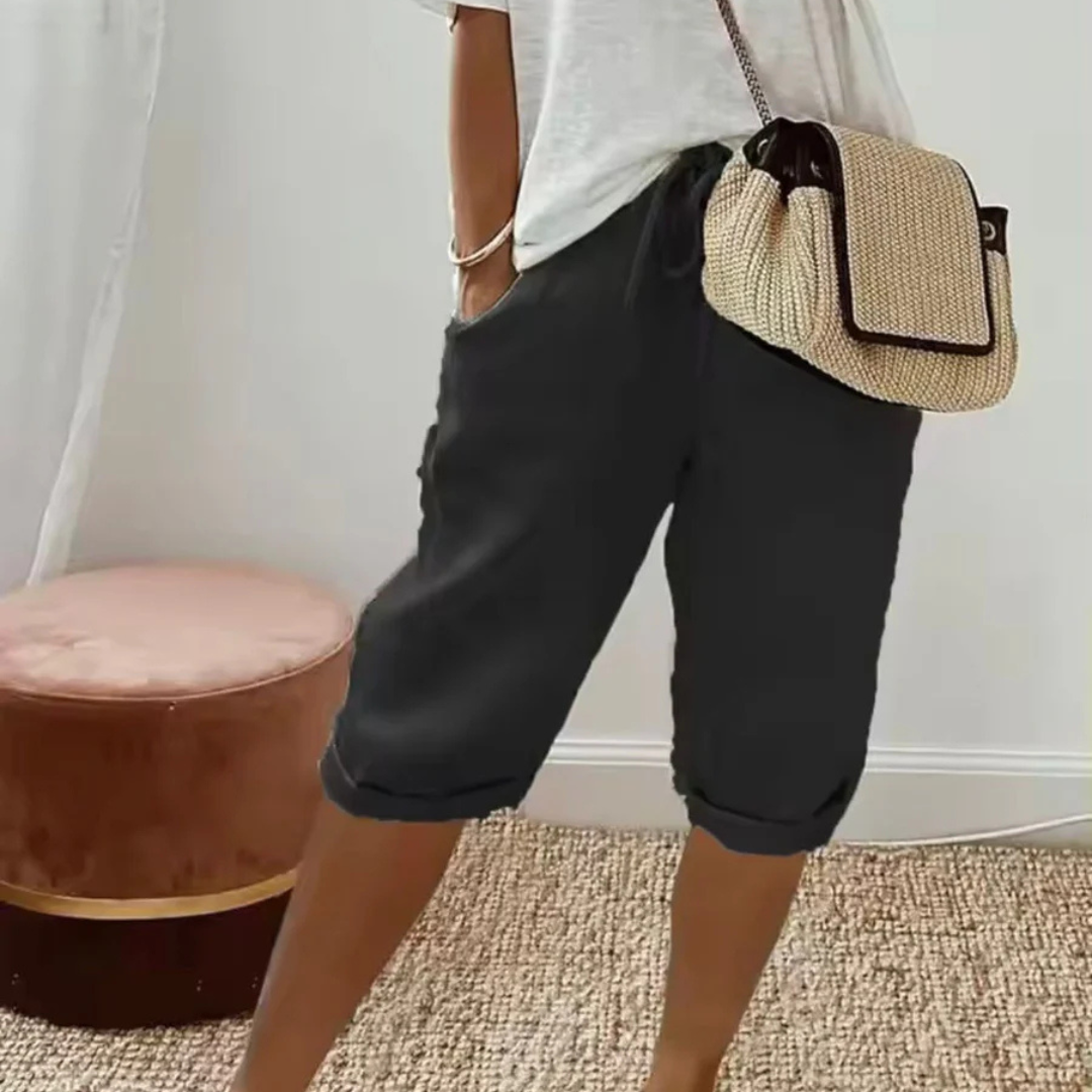 A pair of relaxed-fit summer shorts in beige with an elasticated drawstring waist