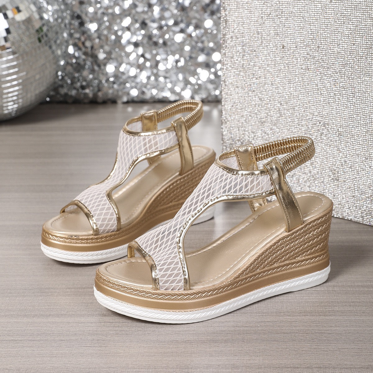 Elegant wedge sandals with a shimmer embellished upper and ankle strap in black and beige