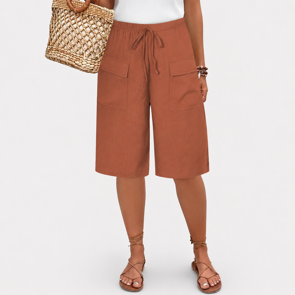 Women's high-waist shorts in terracotta with a relaxed leg and elasticated waistband