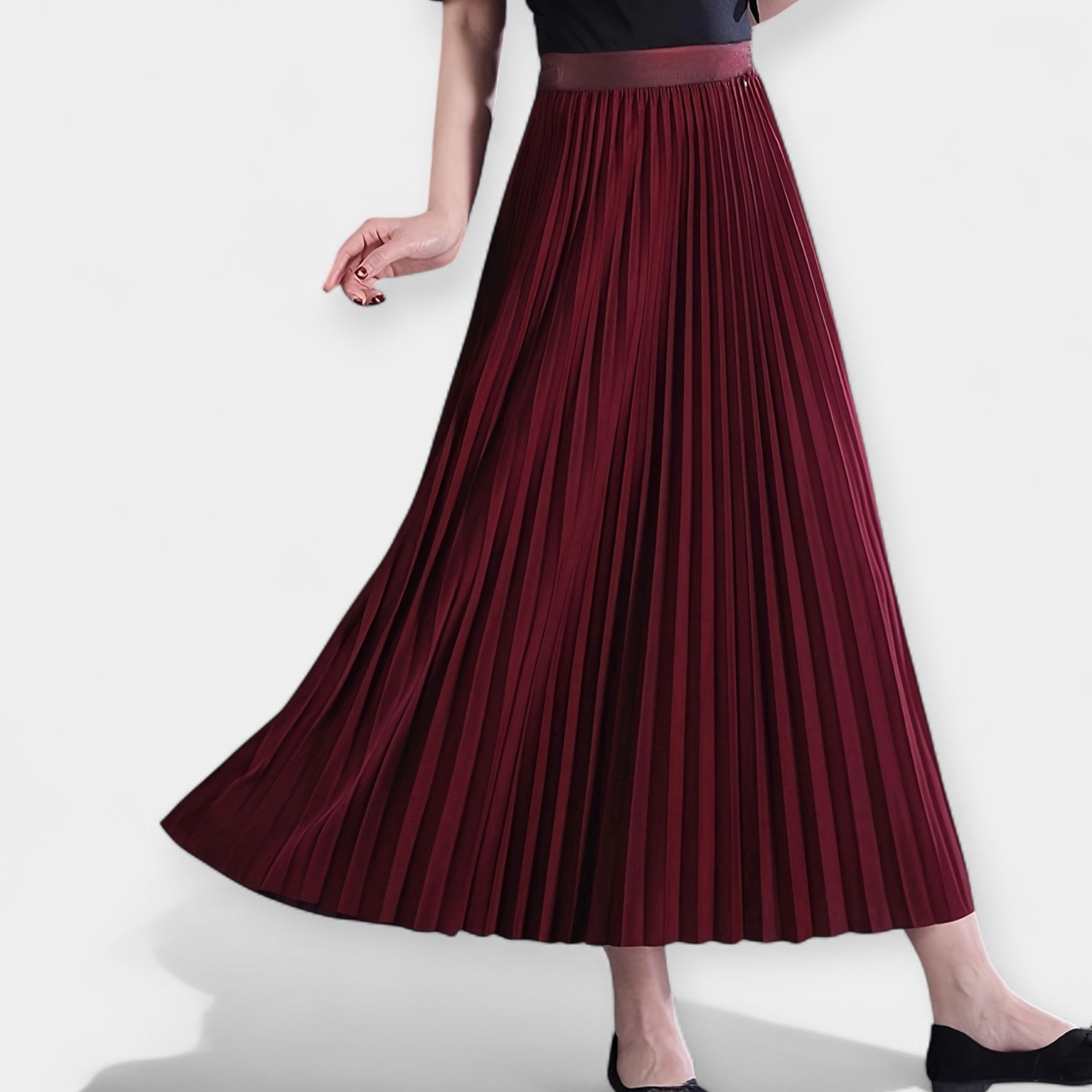 Wide pleated high-waist midi skirt in soft blush pink with a flowing silhouette