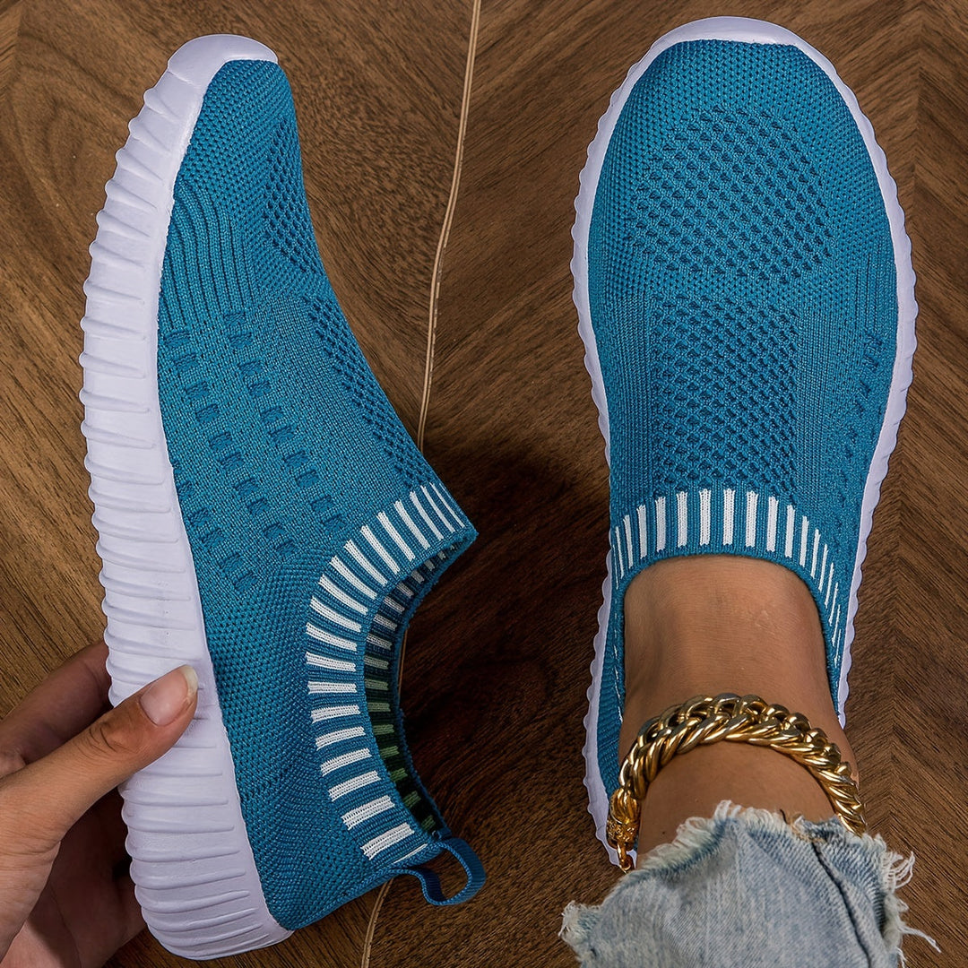 A woman slipping on ultralight sock-style trainers that hug the foot.