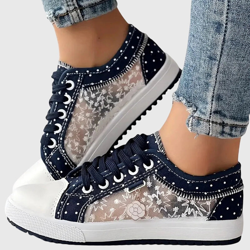 A woman walking comfortably in blue cushioned orthopaedic trainers