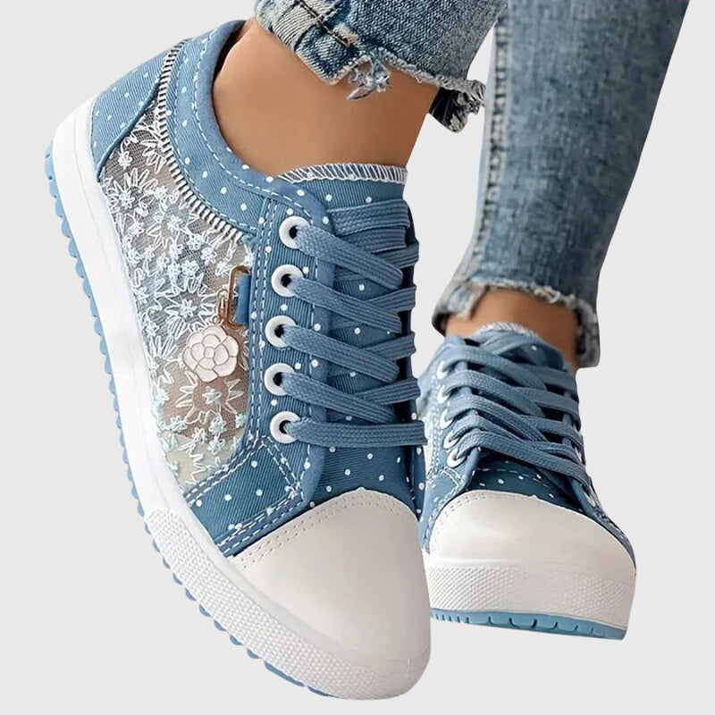 A woman walking comfortably in blue cushioned orthopaedic trainers