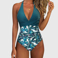 One-piece swimsuit with V-neckline and floral detail in a fresh green tone