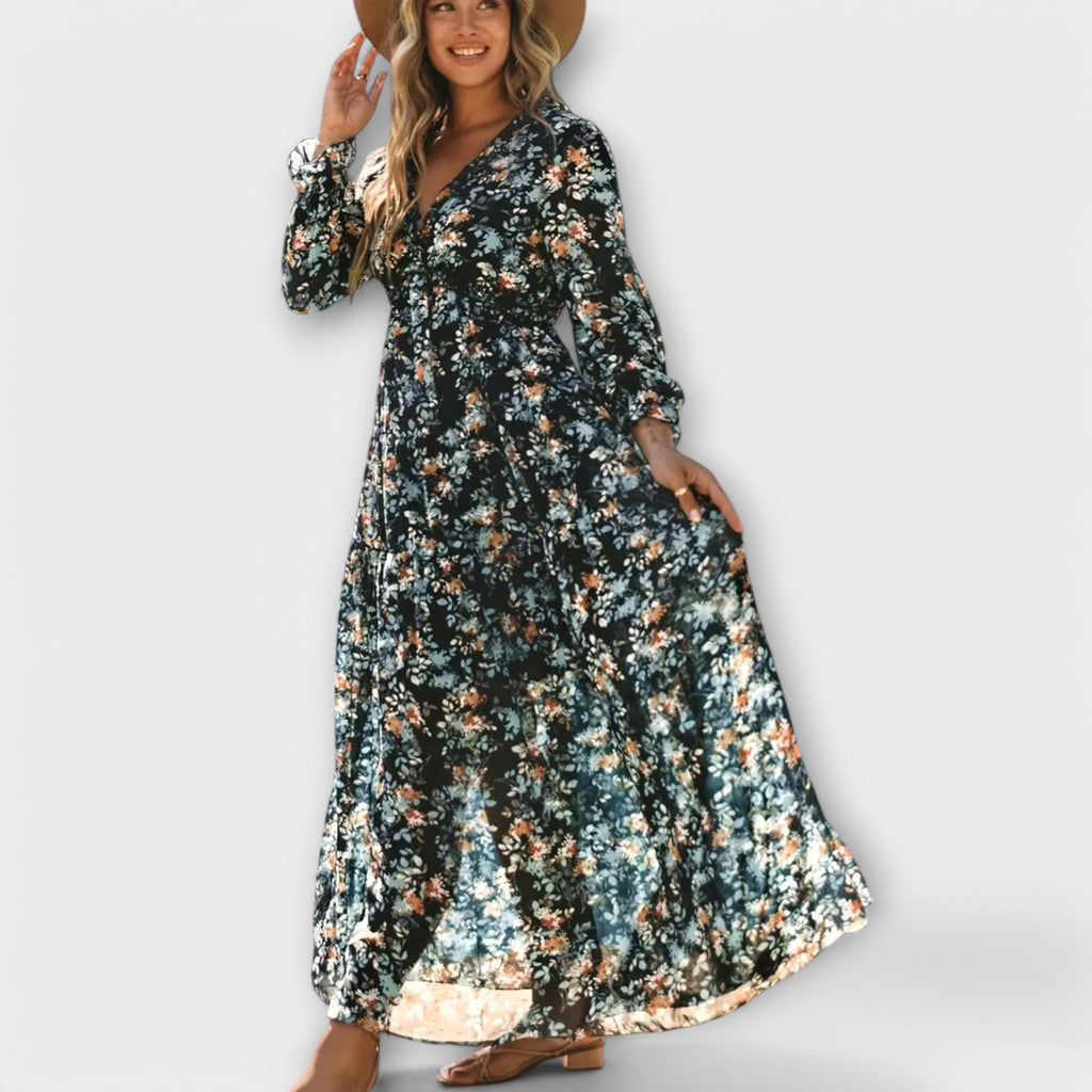 Flowing floral maxi dress with long sleeves and a V-neckline in soft blush pink
