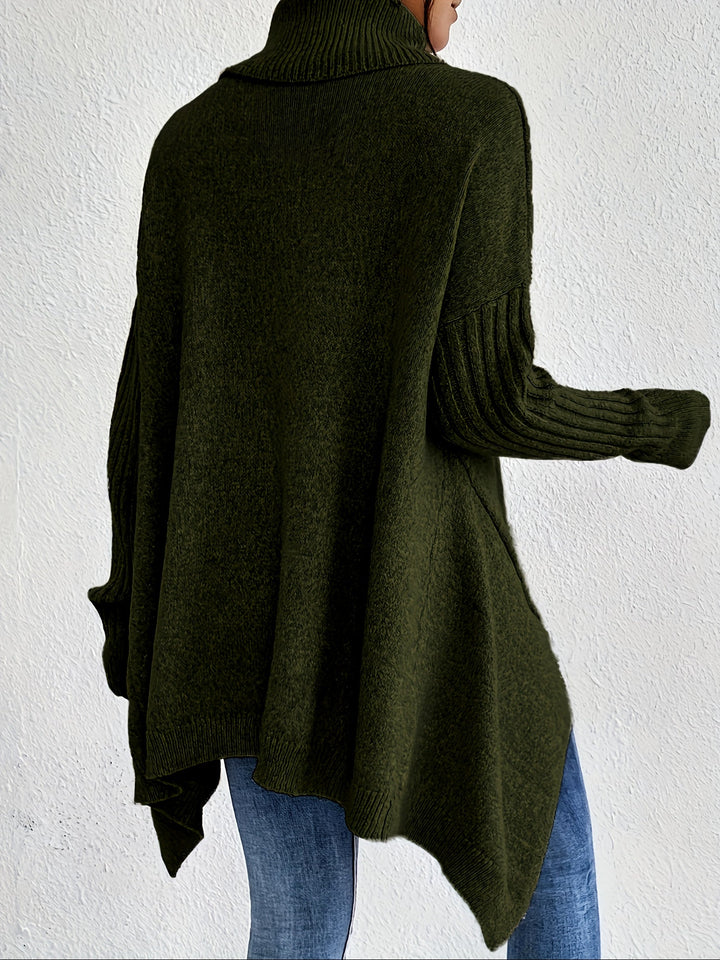 A woman wearing a stand-collar jumper with a chic asymmetric drape, warm and polished.