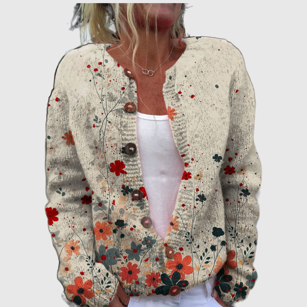 Eimear cardigan with small red and blue blooms on a flecked natural tone – Mary Cork
