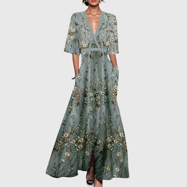 Woman wearing a light floral spring dress with a defined waist and a softly swinging skirt.