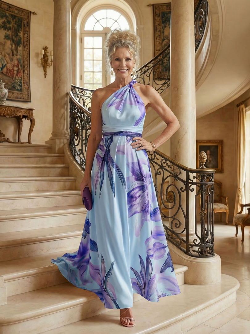 White floral halter-neck maxi dress with large bold print and flowing relaxed skirt