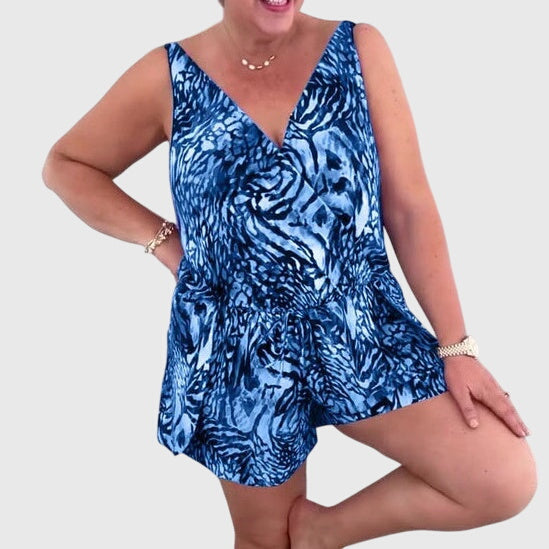 Women's swim dress in blue, purple and green with an elegant skirt silhouette
