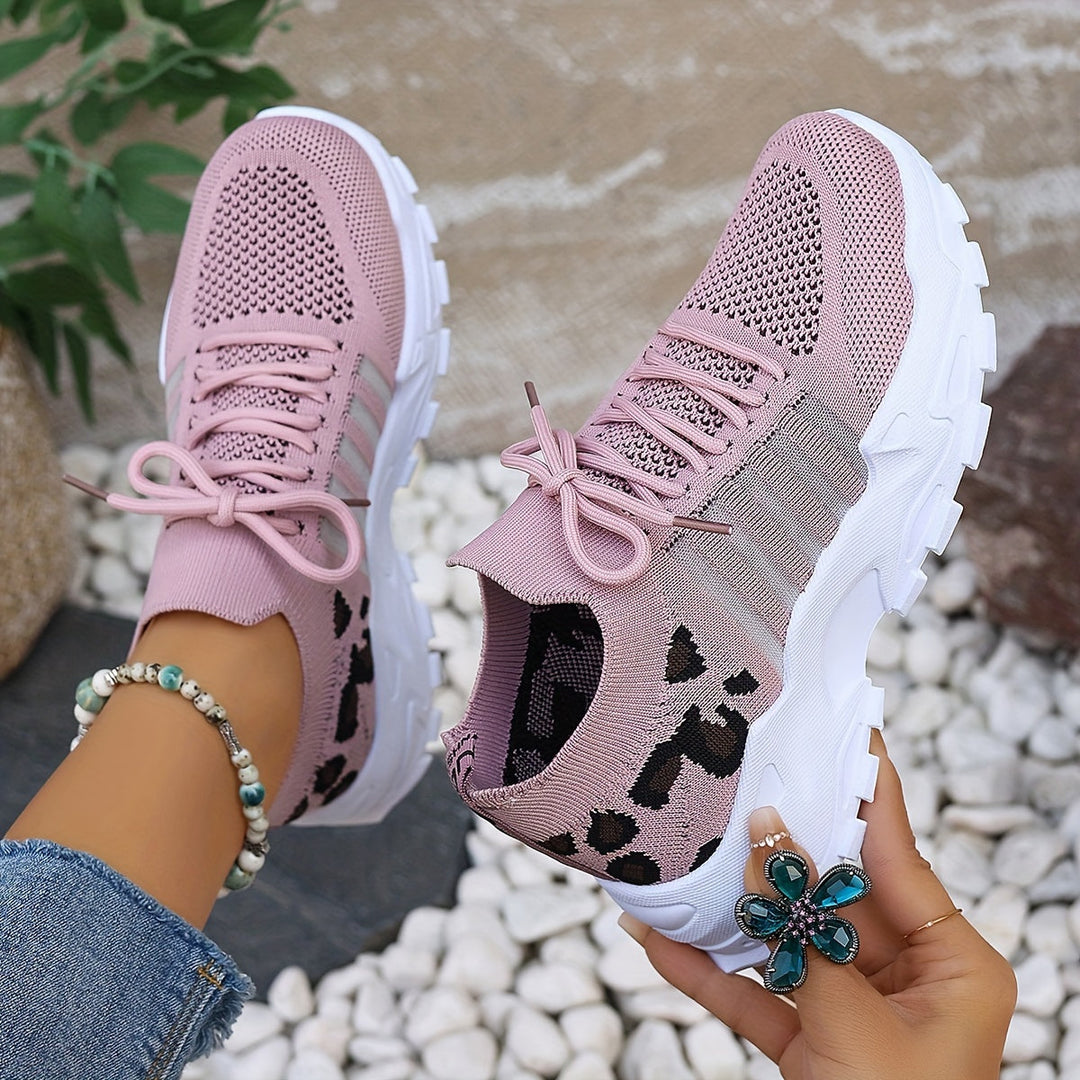 A woman walking in light, breathable comfort trainers on a warm day.