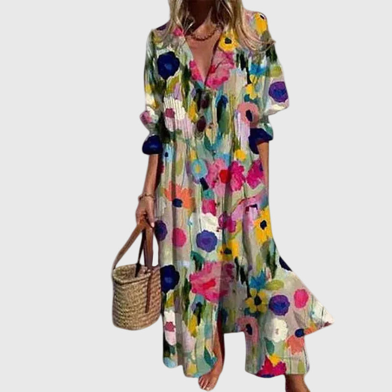 Woman in a long flowing boho-style maxi dress with delicate patterns, walking outdoors.