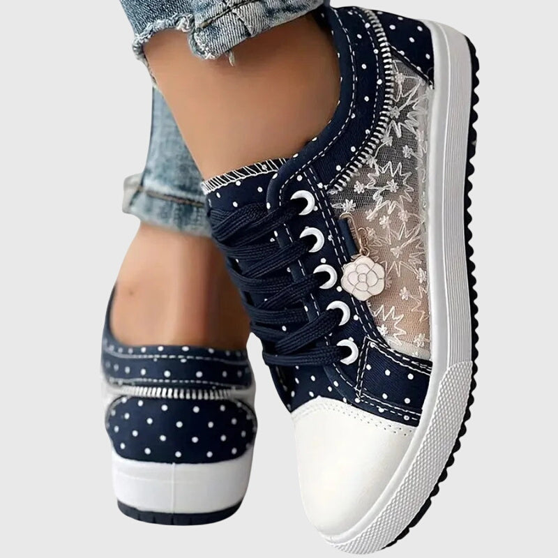 A woman walking comfortably in blue cushioned orthopaedic trainers